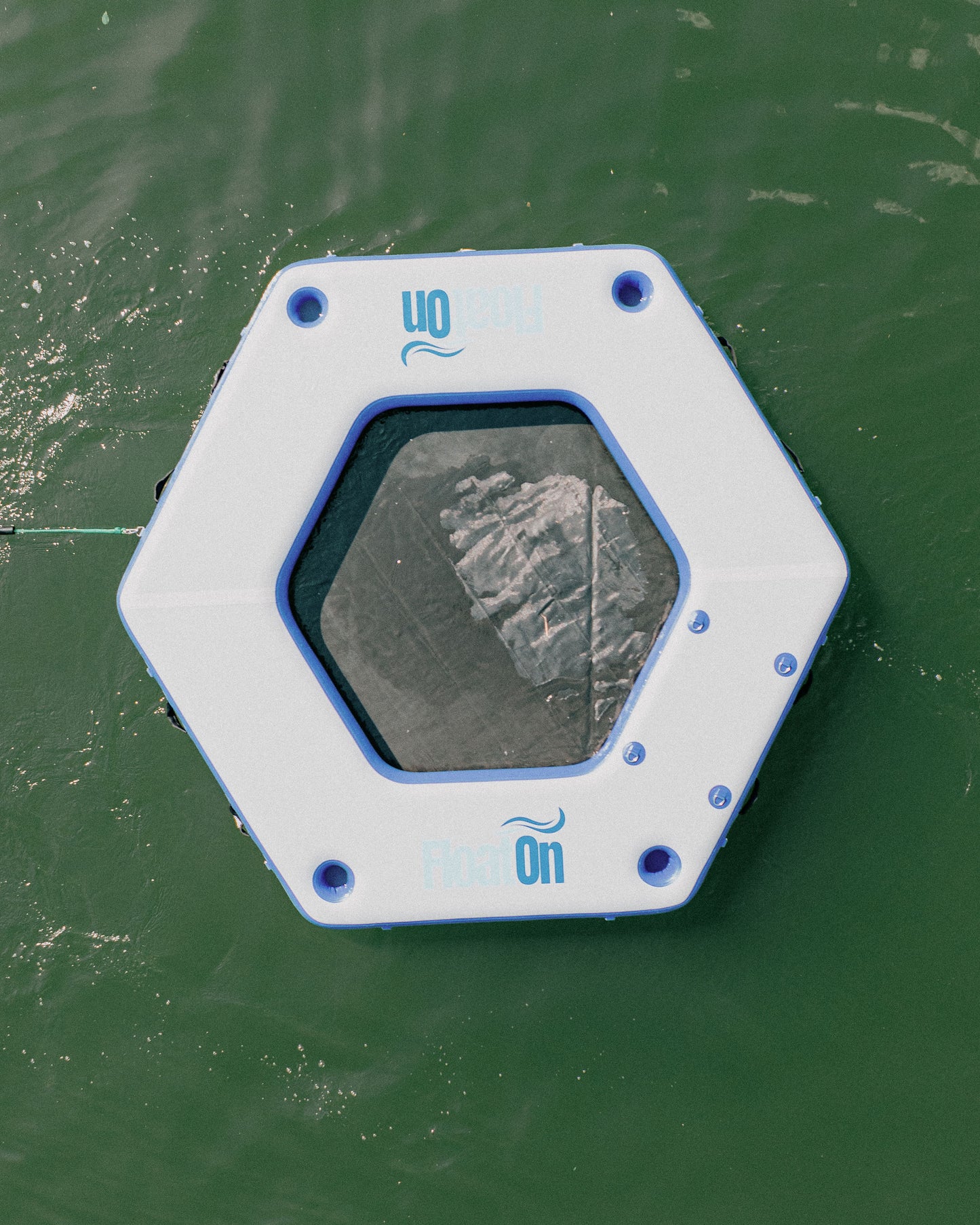 The 9ft Oasis water mat floating on the lake.