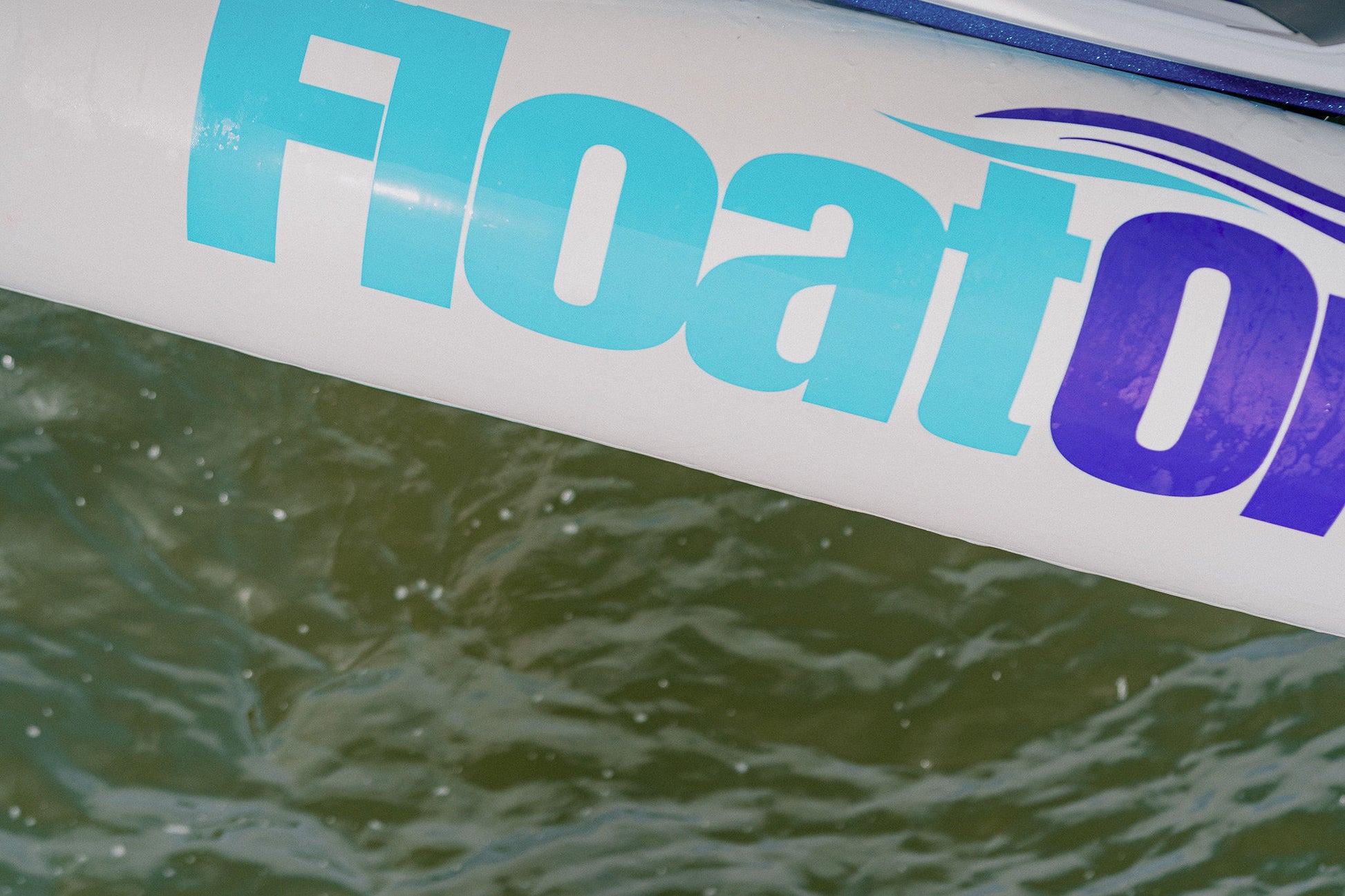 A close up view of the Tide Guard inflatable boat fender by Float On at the lake.
